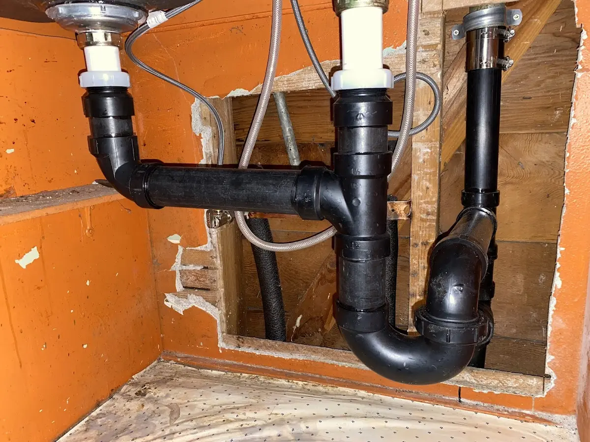 Professional Garbage Disposal Repair equipment and tools on the job in Williston